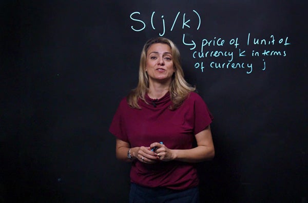 Instructor Ozgur Arslan Ayaydin helps students by annotating a Lightboard to reinforce her explanation.